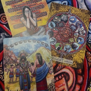May include: Four tarot cards with colorful illustrations are displayed. The cards feature images of figures, symbols, and text, including "Wheel of Fortune" and "Ten of Cups". The background is a patterned fabric with red, blue, and orange hues.