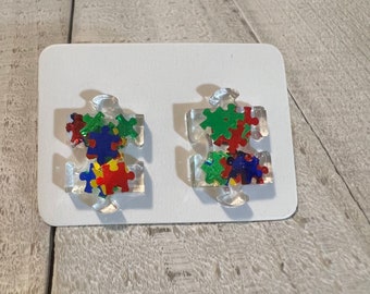 Autism awareness puzzle piece studs; puzzle shape