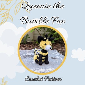 May include: Crochet pattern for a bee-themed fox amigurumi toy named "Queenie the Bumble Fox". The toy is yellow and black with a white face and is sitting on a grey rock.