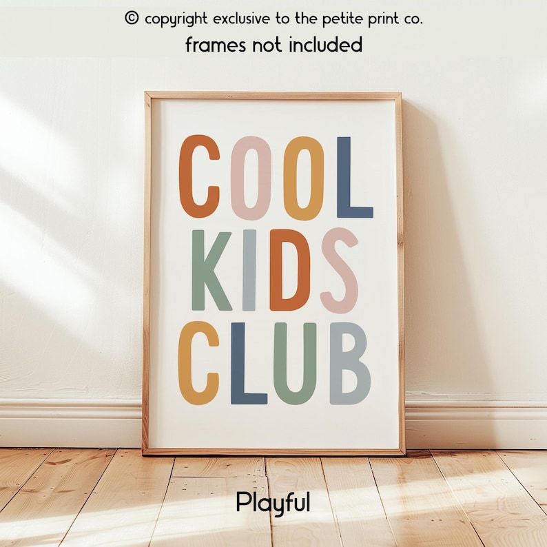May include: A rectangular wall art print featuring the text COOL KIDS CLUB in a bold, sans-serif font. The letters are colored in muted shades of orange, pink, yellow, blue, and sage green against a white background. The print is displayed in a frame.