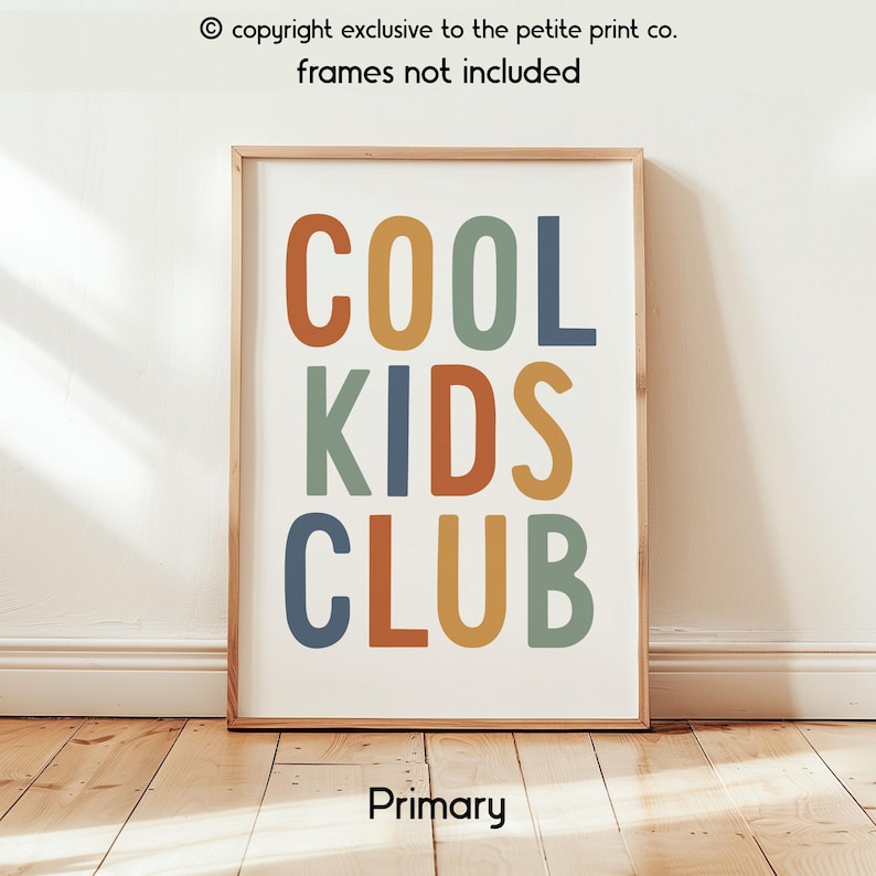 May include: A rectangular wall art print featuring the text COOL KIDS CLUB in a bold, sans-serif font. The letters are colored in muted shades of terracotta, mustard yellow, sage green, and slate blue against a white background.