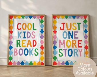 May include: Two rectangular wall art prints in wooden frames. The left print features the text COOL KIDS READ BOOKS in multicoloured letters. The right print features the text JUST ONE MORE STORY in multicoloured letters. Both have diamond borders.