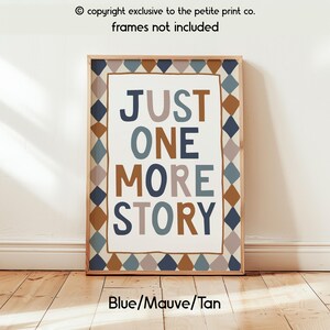 May include: A rectangular wall art print featuring the text "JUST ONE MORE STORY" in blue, mauve, and tan lettering. The central text is enclosed by a border of repeating diamond shapes in alternating shades of blue, mauve, and tan colours.