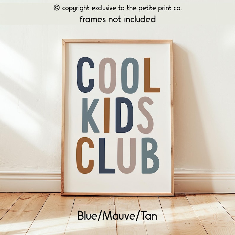 May include: A rectangular wall art print featuring the text COOL KIDS CLUB in a bold, sans-serif font. The letters are colored in alternating shades of navy blue, mauve, and tan. The text copyright exclusive to the petite print co. is visible.