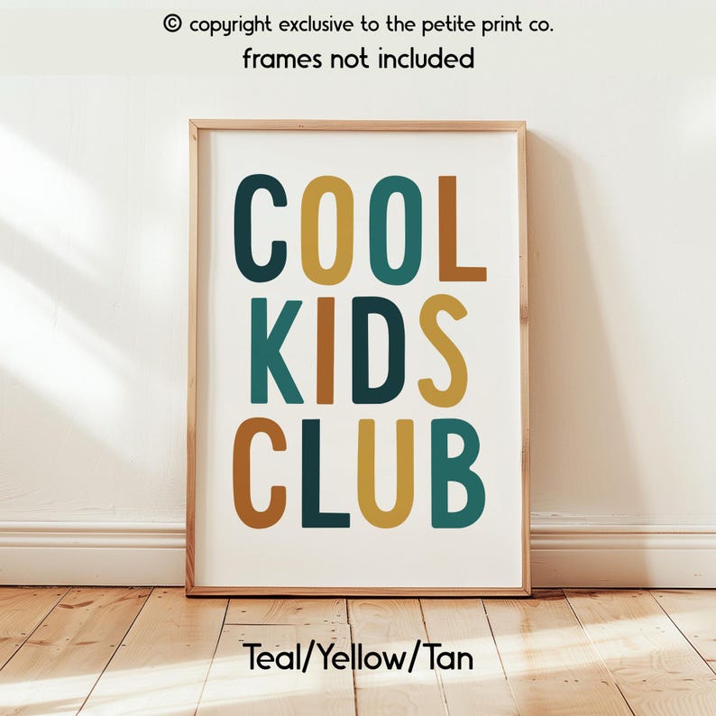 May include: A rectangular wall art print featuring the text COOL KIDS CLUB in a bold, sans-serif font. The letters are colored in alternating shades of teal, mustard yellow, and tan against a white background. The print is housed in a light wood frame.