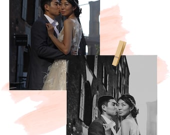 May include: A black and white photo of a couple in wedding attire, embracing in front of a brick building. The woman is wearing a white gown with a feathered skirt and the man is wearing a suit. The couple is looking at each other.