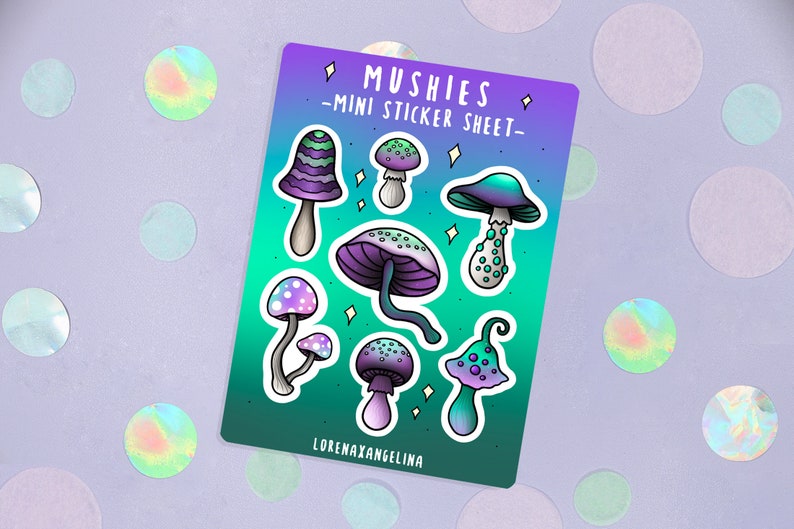 May include: A sticker sheet with a gradient background of teal and purple. The sheet features a variety of colorful mushroom illustrations with white polka dots and swirls. The text "Mushis - Mini Sticker Sheet -" is printed at the top of the sheet. The text "LorenaxAngelina" is printed at the bottom of the sheet.