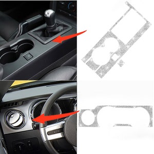 May include: A set of two silver glitter car interior trim pieces. The trim pieces are designed to fit the center console and dashboard of a Ford Mustang. The trim pieces are shown next to the corresponding areas on the car's interior.