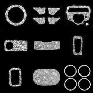 May include: A set of 10 silver glitter car interior trim pieces. The set includes a steering wheel cover, gear shift cover, cup holder cover, door handle covers, and a center console cover.