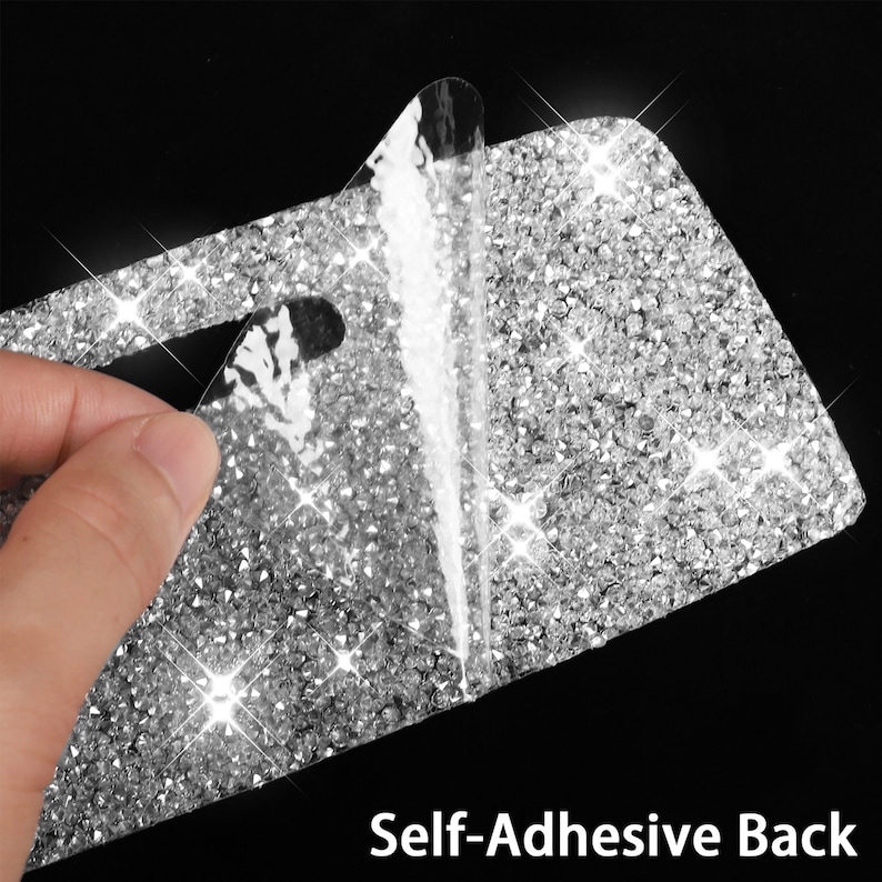 May include: A close-up of a silver sparkly adhesive sheet with a clear backing being peeled off. The sheet is covered in small, shiny rhinestones. The text "Self-Adhesive Back" is visible at the bottom of the image.