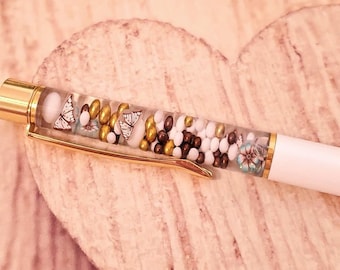 White butterflies float pen