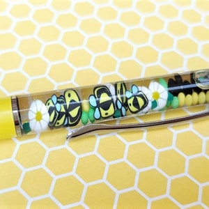 Bees and blossoms float pen