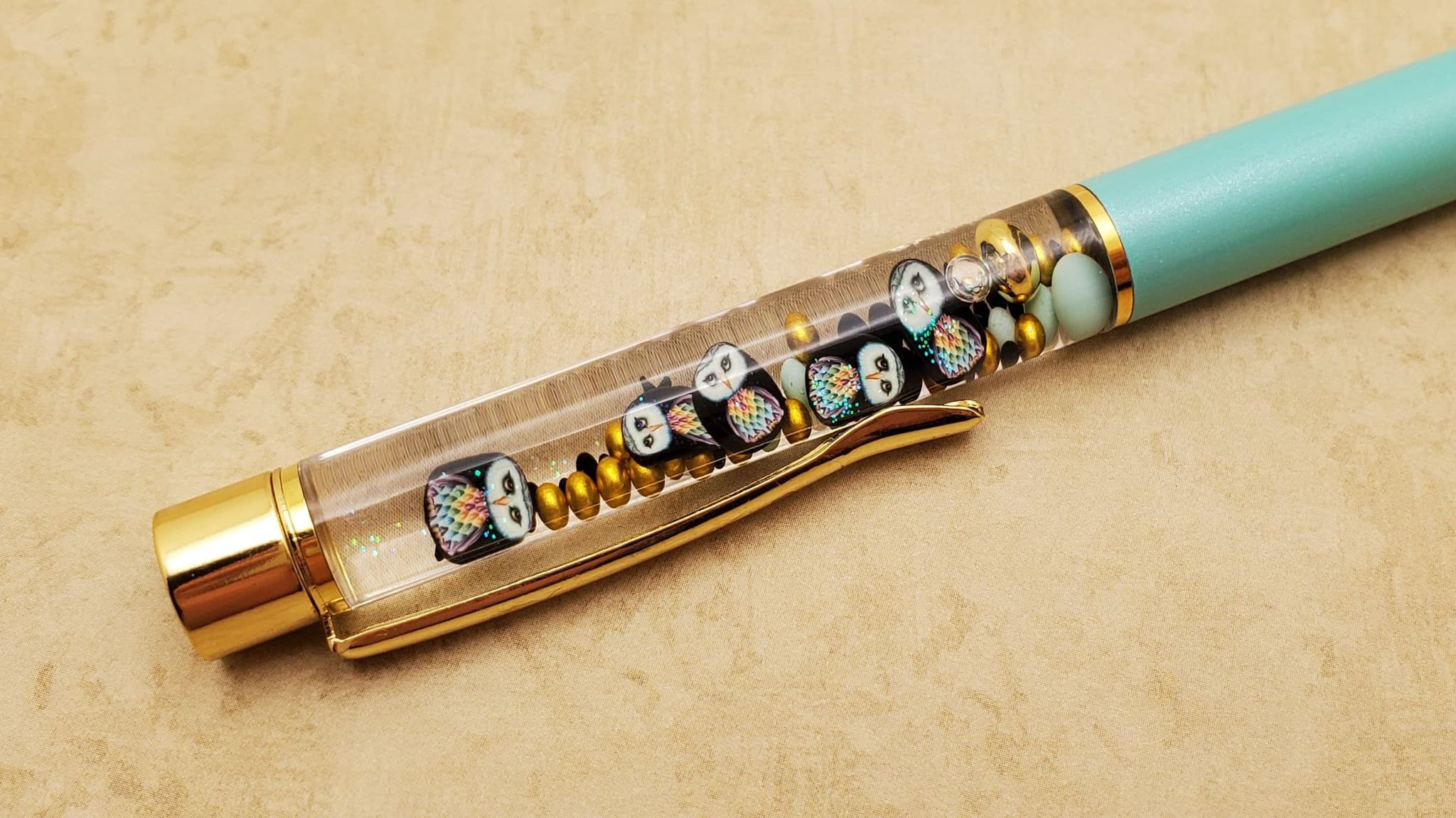 Rainbow owls float pens