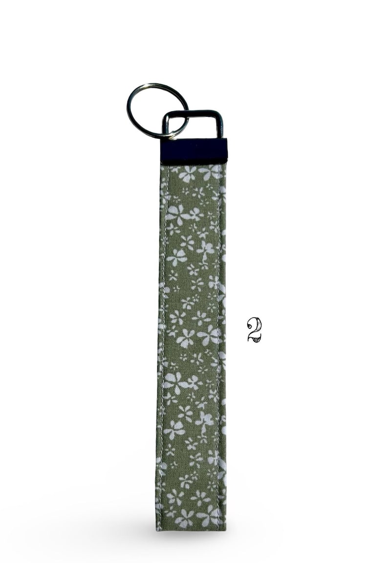 Handmade Fabric Wristlet Durable Construction Keychain Metal Hardware Details Floral Pattern Design Gingham Style Accent Vintage Inspired Look Shabby Chic Aesthetic Multiple Color Options Pink Sage Green Cream Six Inch Length Practical Car