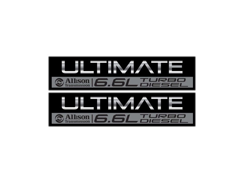 May include: Two black rectangular decals with silver text. The top decal reads "ULTIMATE" above "Allison Transmission 6.6L TURBO DIESEL". The bottom decal mirrors the top. The background is white.