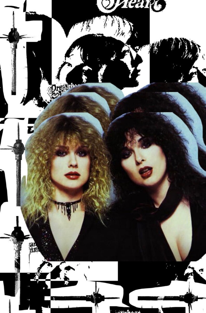 May include: A black and white photo of two women with long hair. The women are wearing black clothing and have a serious expression on their faces. The text "Heart" is visible in the background.