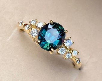 Peacock Sapphire Engagement Ring: Oval Teal Sapphire, Diamond Cluster, 14k Yellow Gold