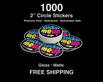 May include: A stack of 1000, 5.08 cm circle stickers with the text "sticker me up" in a colourful design. The stickers are premium vinyl, waterproof, and dishwasher safe. The image also displays "Gloss • Matte".
