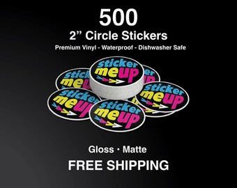 May include: A collection of 5 cm circle stickers with the text "sticker me up" in a vibrant design. The stickers are premium vinyl, waterproof, and dishwasher safe. The image also displays the text "500" and "Gloss • Matte".