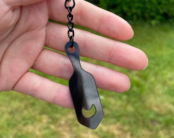 Black paddle shaped keychain, bondage keyring