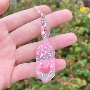 Pink glitter paddle shaped keychain, bondage keyring