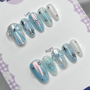 Handmade Iridescent Blue Press On Nails | Chrome Star Accents with 3D Bows and Glitter Tips | Almond Nails for Celestial Look