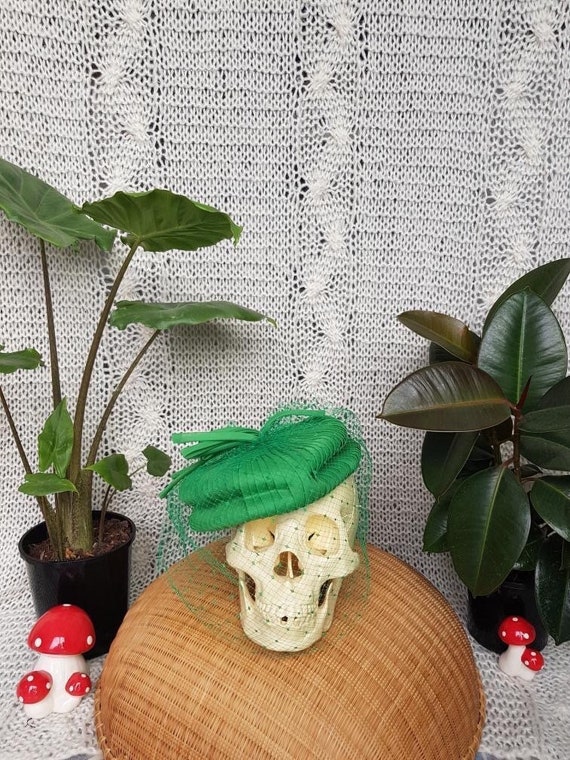 Green pill box hat with netting