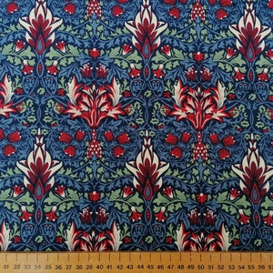 May include: A repeating pattern of stylised flowers and leaves in shades of red, white, green, and blue on a dark blue background.
