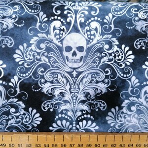 May include: Black fabric with a white damask pattern and white skull designs.