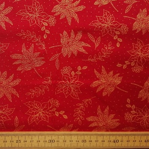 May include: Red fabric with a gold leaf and floral pattern. The fabric has a subtle sparkle.