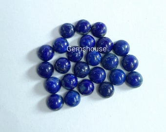 May include: A group of 20 round, blue lapis lazuli cabochons, each with a slightly different pattern of white and gold flecks. Gemhouse is printed on the white background.