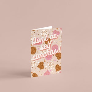 May include: A pink and brown card with a pattern of sweet bread pastries and the text "don't be self conchas!"