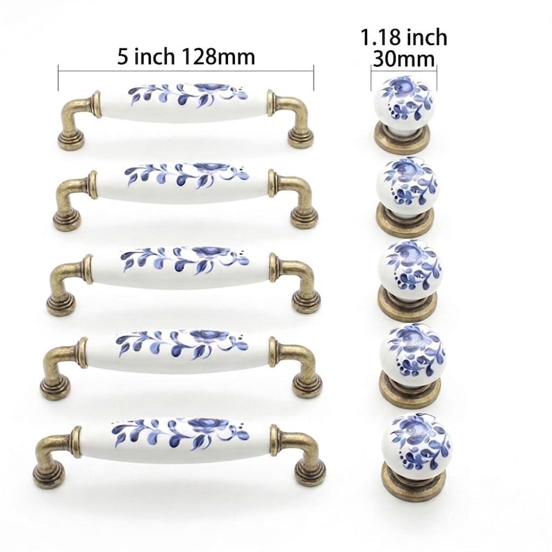 Set of vintage blue and white floral ceramic drawer pulls with 5 inch hole centers and matching 1.18 inch round cabinet knobs with antique brass bases.