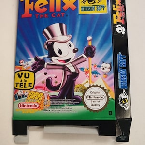 May include: A vintage video game box for the Nintendo Entertainment System (NES) featuring Felix the Cat. The box is blue, green, and black with a cartoon image of Felix the Cat in a top hat and tuxedo. The box also features the text "Felix the Cat" and "Hudson Soft".