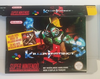 May include: A Super Nintendo game box for Killer Instinct. The box is black with a red, yellow, and green logo. The front of the box features a green and black character with a helmet. The text "Killer Instinct" is printed in red and white. The box also includes a sticker that says "Killer Cuts Music CD Included Inside! CD des Hits de Killer Inclus!"