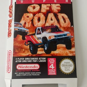 May include: A white and red box for the Nintendo Entertainment System game "Super Off Road". The box features a red and white pickup truck driving on a dirt road. The text "4 Player Simultaneous Action!" is on the box. The box also has the Nintendo Seal of Quality.