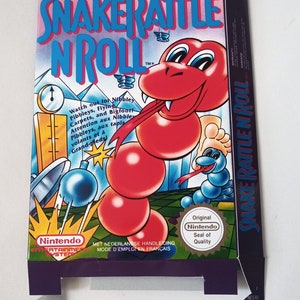 May include: A box for the Nintendo Entertainment System game Snake Rattle 'n' Roll. The box is purple and features a red snake with a blue tongue. The text on the box reads "Snake Rattle 'n' Roll" and "Original Nintendo Seal of Quality".