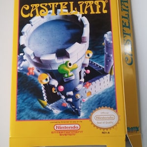 Pode incluir: Uma caixa de jogo Nintendo Entertainment System amarela e preta para o jogo Castellian. A caixa apresenta uma imagem de desenho animado de um castelo com um sapo verde e um fundo azul. O texto "CASTELIAN" está impresso em letras grandes amarelas na parte frontal da caixa.