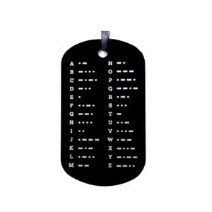 May include: A black dog tag pendant with a silver loop. The tag displays the Morse code alphabet in white dots and dashes. The letters A to Z are arranged vertically on the tag, providing a visual guide to the code.