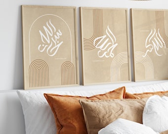 May include: Three beige framed prints with brown and white abstract designs. The prints feature the Arabic word "Allah" in white calligraphy. The prints are hanging on a white wall above a bed with brown and white pillows.