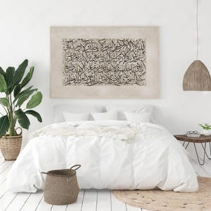 Abstract black and beige Quranic wall decor with Ayatul Kursi verse.