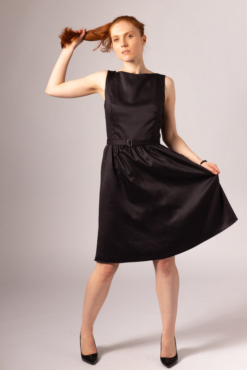 Black bamboo vegan silk knee length dress with pockets and belt.  Audrey Hepburn inspired 1950s style dress,