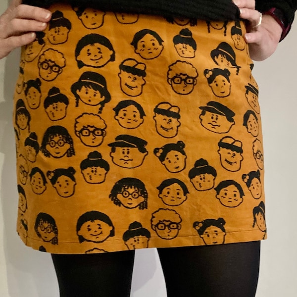 Mini skirt | Quirky skirt | Cord effect skirt | Mustard skirt | Cartoon faces