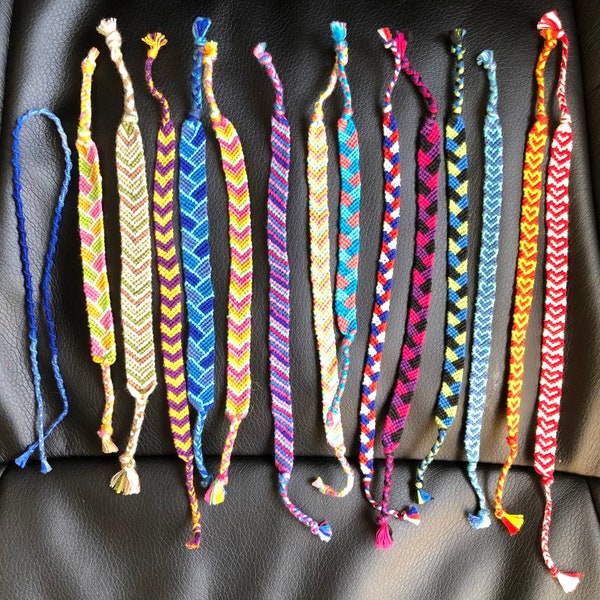 FRIENDSHIP BRACELETS. Variety. Woven friendship bracelets. Comes as they are. All going for three dollars. Braided stitch, chevron, and more