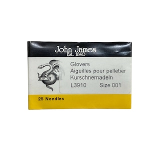 May include: A yellow and black packet containing 25 glovers needles, size 001. The packet features a black and white illustration of a snake with a crown on its head. The text on the packet reads "John James Est. 1840 Glovers Aiguilles pour pelletier Kurschnernadeln L3910 Size 001 25 Needles".