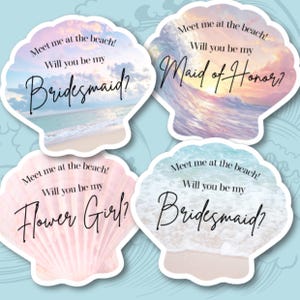 May include: Four seashell-shaped cards with beach-themed backgrounds and text. The cards read "Meet me at the beach! Will you be my Bridesmaid?" "Maid of Honor?" "Flower Girl?" and "Bridesmaid?" in elegant script.