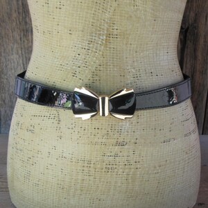 Vintage 80s Black Elastic Waist‎ Belt with Sculptural Silver Bow Buckle Vintage Black Sequin Elastic Belt With Silver Bow Clasp  main image 4