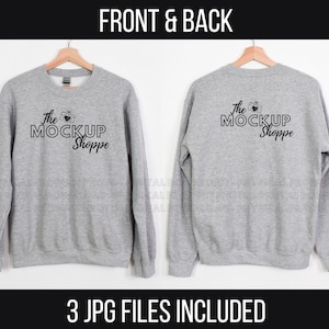May include: A gray sweatshirt mockup with the text "The Mockup Shoppe" and a camera icon on the front and back.