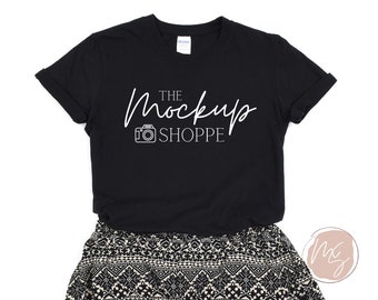 May include: Black t-shirt with a white graphic that says "The Mockup Shoppe" and a camera icon.