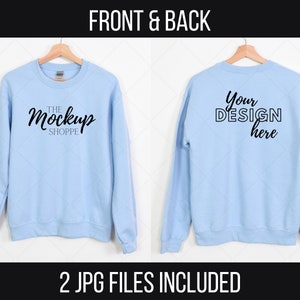 May include: A light blue sweatshirt mockup with the text "THE MockUp SHOPPE" on the front and "Your DESIGN here" on the back.